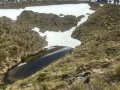 The tarn, within recent snow.