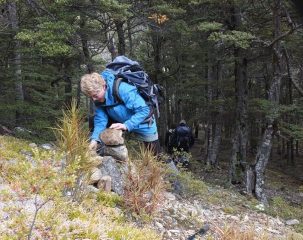 Phyllis building the cairn