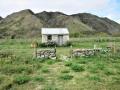 Stone cottage below Waitaki Dam