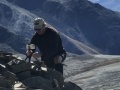 Rodney-taking-a-group-photo-on-top-of-Koharau-with-Mt-Cook-behind